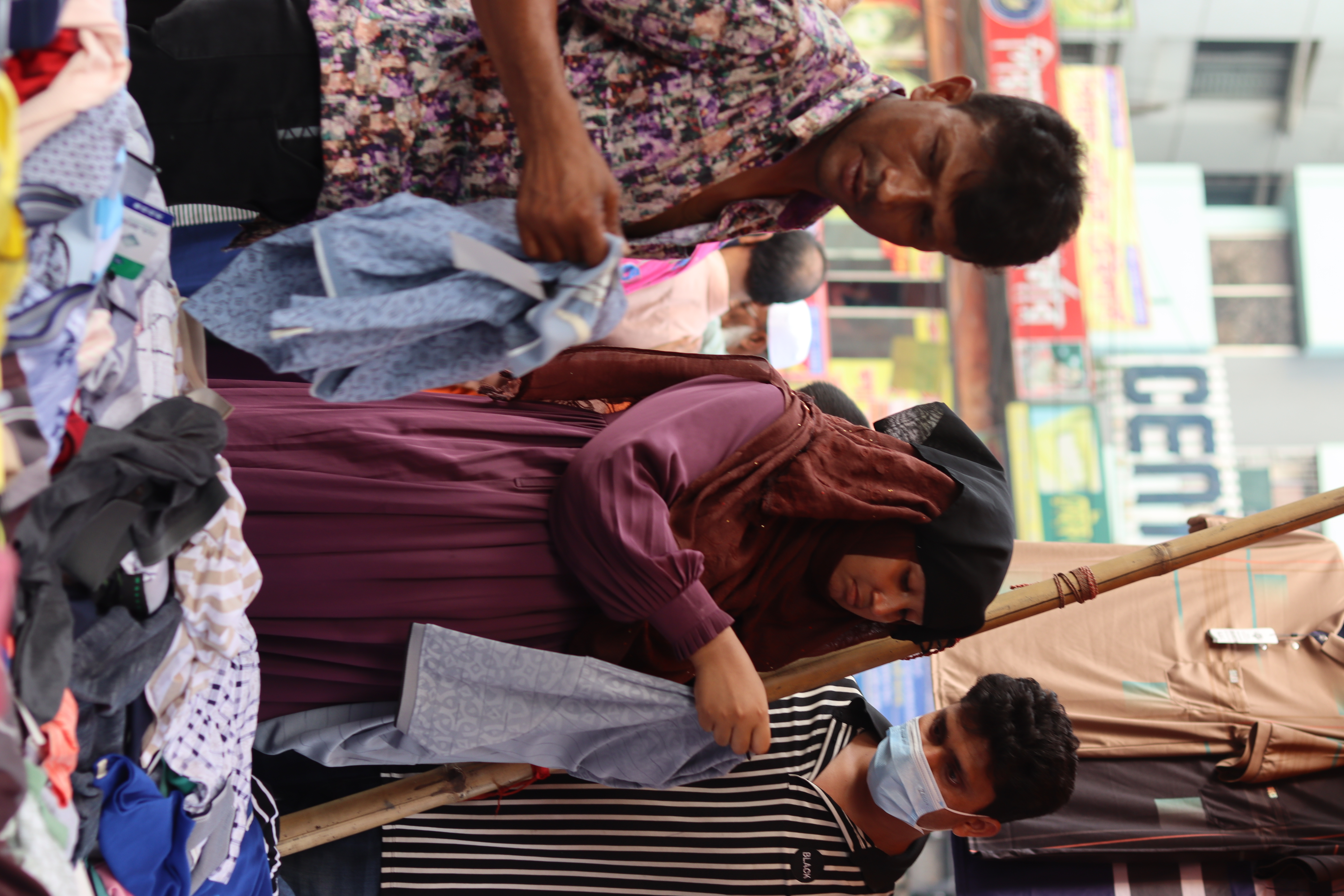 Shoppers and vendors at a market in Motijheel, Dhaka.