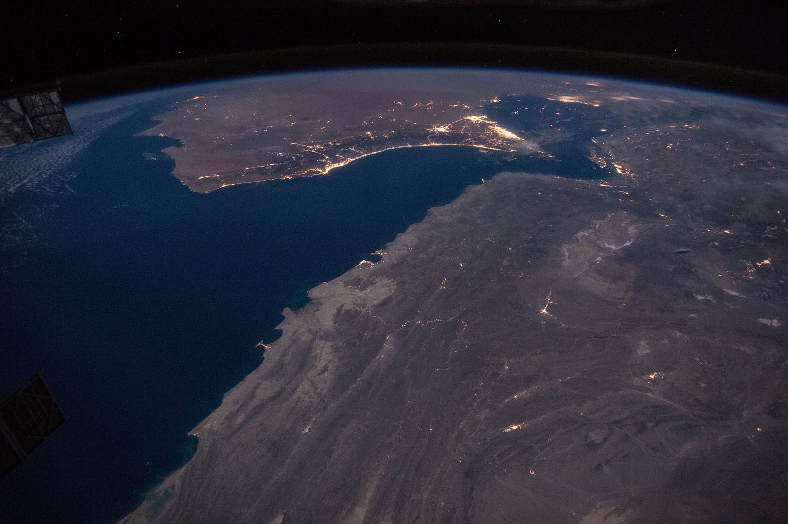 The Gulf of Oman and the Strait of Hormuz photographed at night from the International Space Station. File photo, not the October 2026 tanker incidents.
