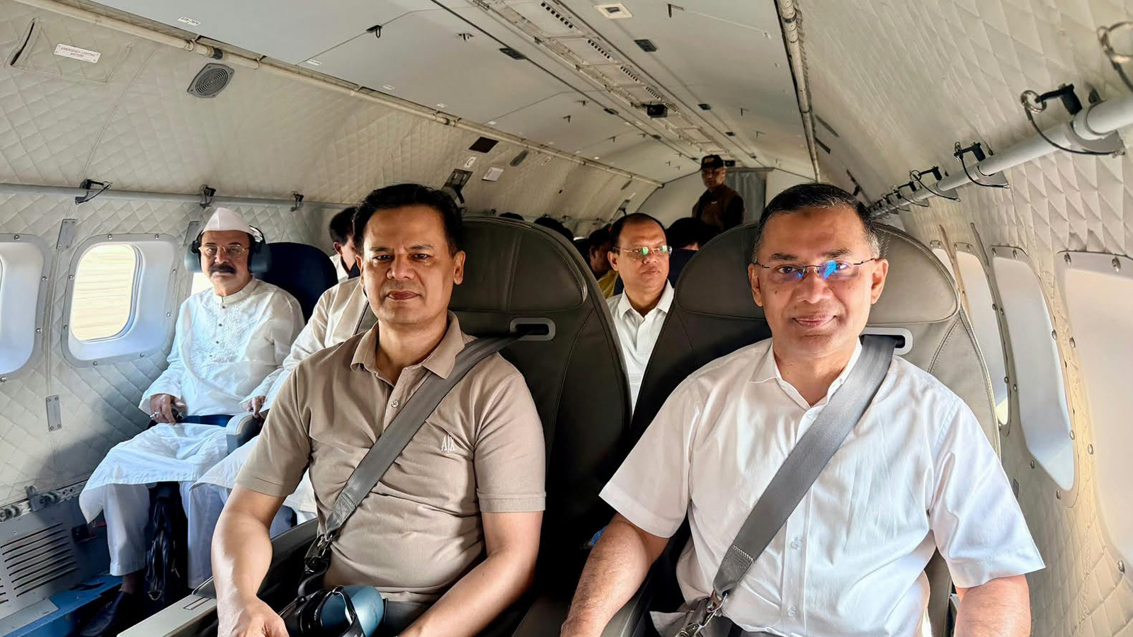 The prime minister's delegation sits aboard a military aircraft on the way to Saidpur on Tuesday morning.