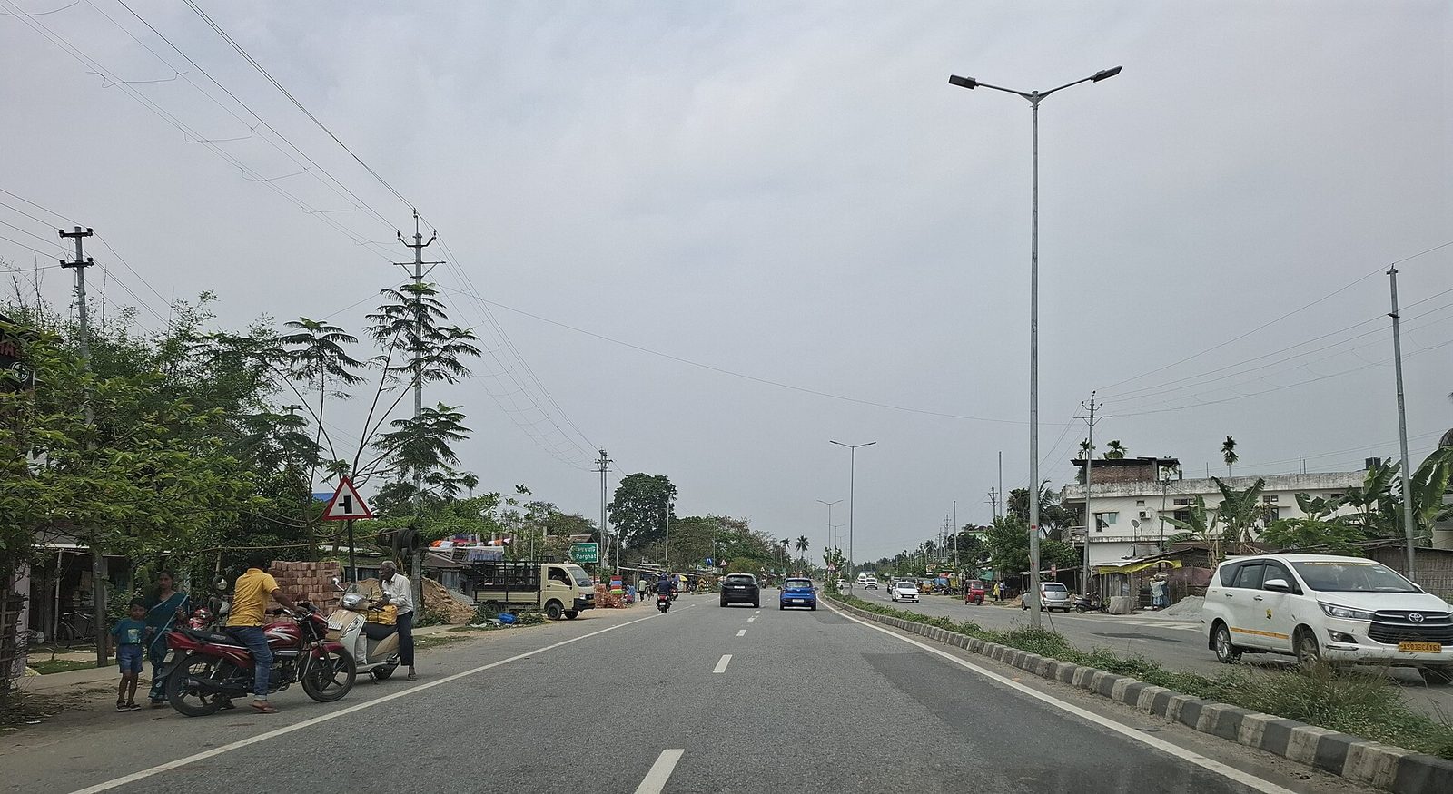 A village road at Puranigudam in Nagaon district, Assam, in a 2025 photograph. Nagaon was the centre of this week's eviction drives; the image shows the district, not the eviction site.