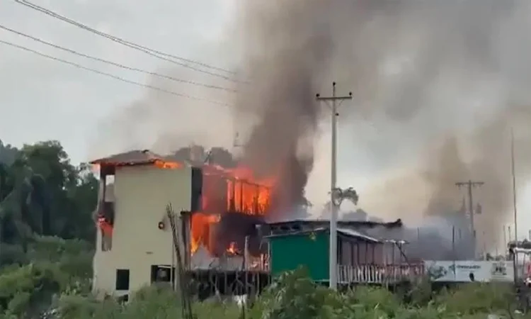 Flames and heavy smoke rise from a burning multi-storey wooden resort at Inani in Cox's Bazar, photographed soon after the 17 October 2026 fire broke out.