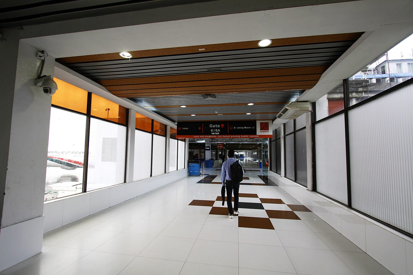 A passenger walks through the international departure corridor at Hazrat Shahjalal International Airport in Dhaka in July 2015 (file photo).