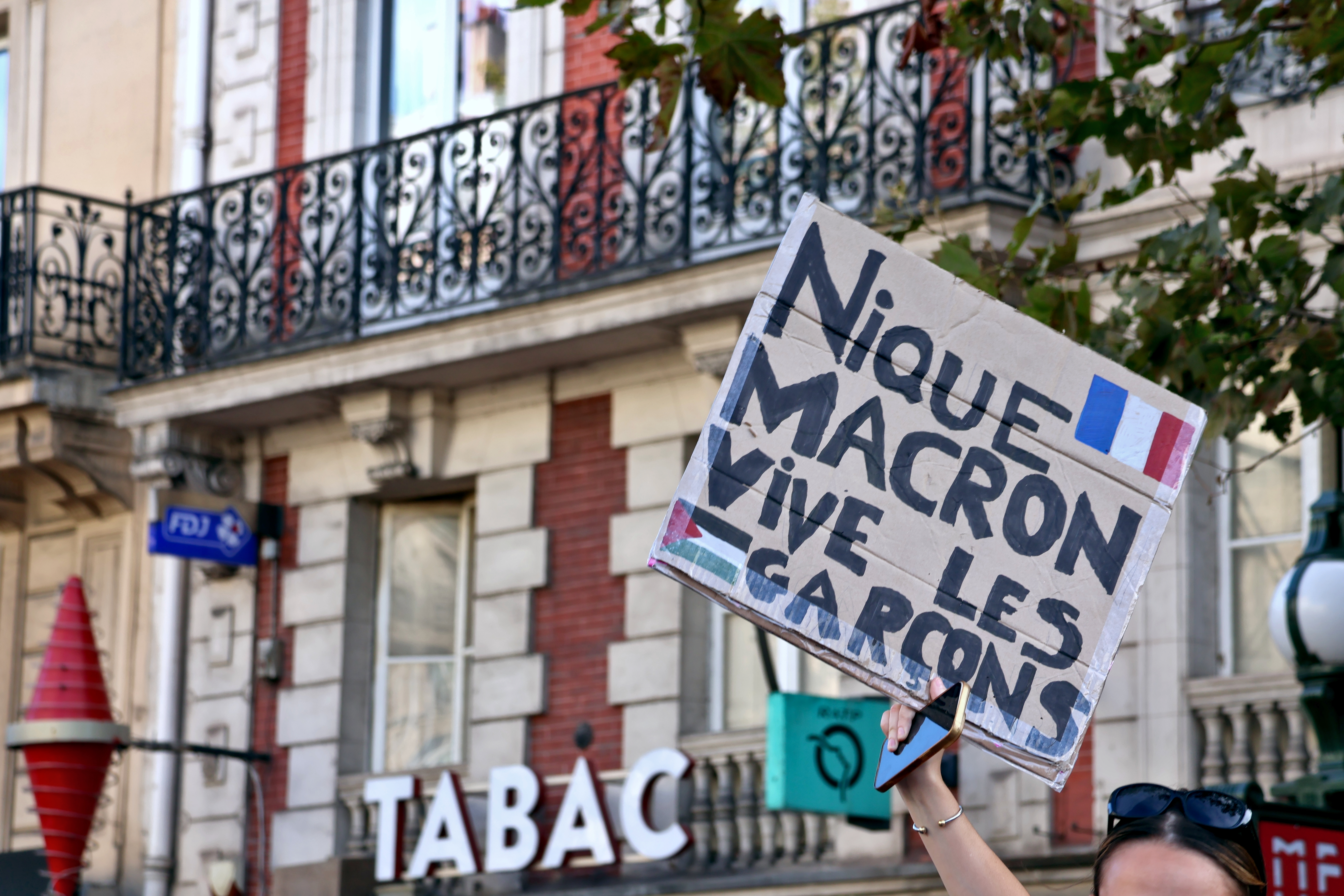 A protester holds a sign at a student demonstration in Paris on 6 October 2026, part of the school protests that have swept France for weeks. File photograph. Photo: FreCha via Wikimedia Commons (CC BY-SA 4.0).