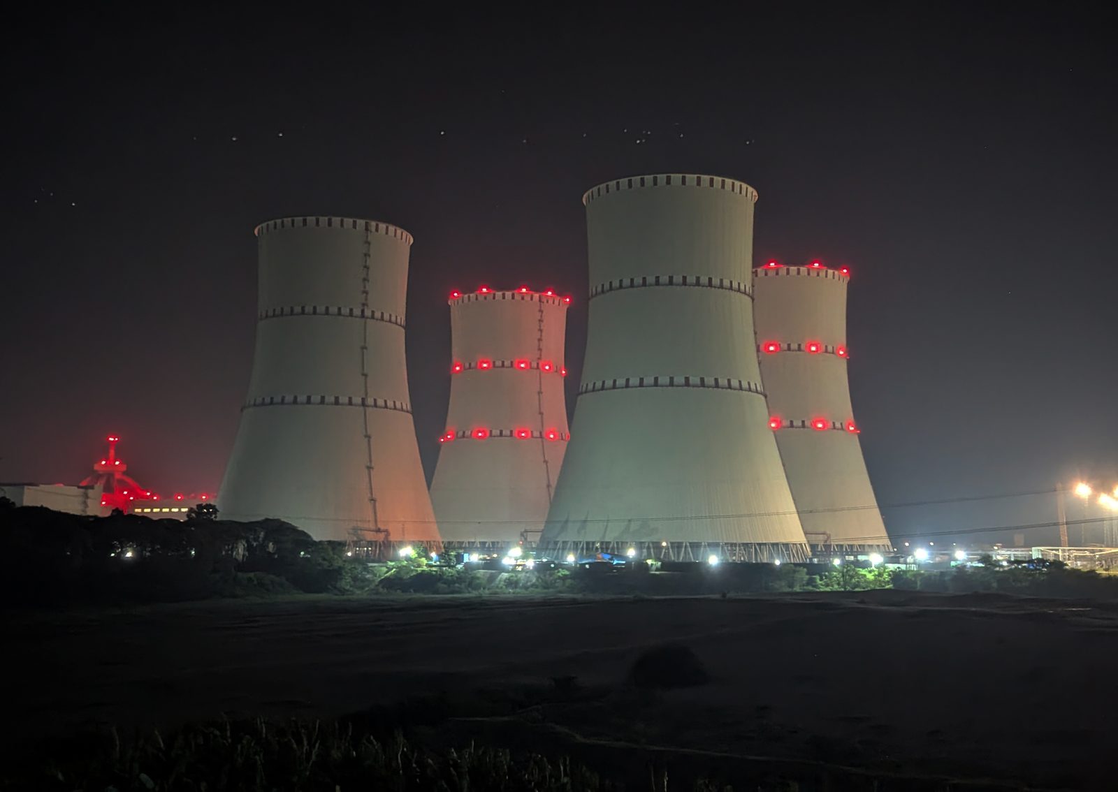 The cooling towers of the Rooppur Nuclear Power Plant in Ishwardi, Pabna, photographed at night in May 2026. A second consignment of uranium fuel for the plant's second unit reached the site on 21 October 2026.