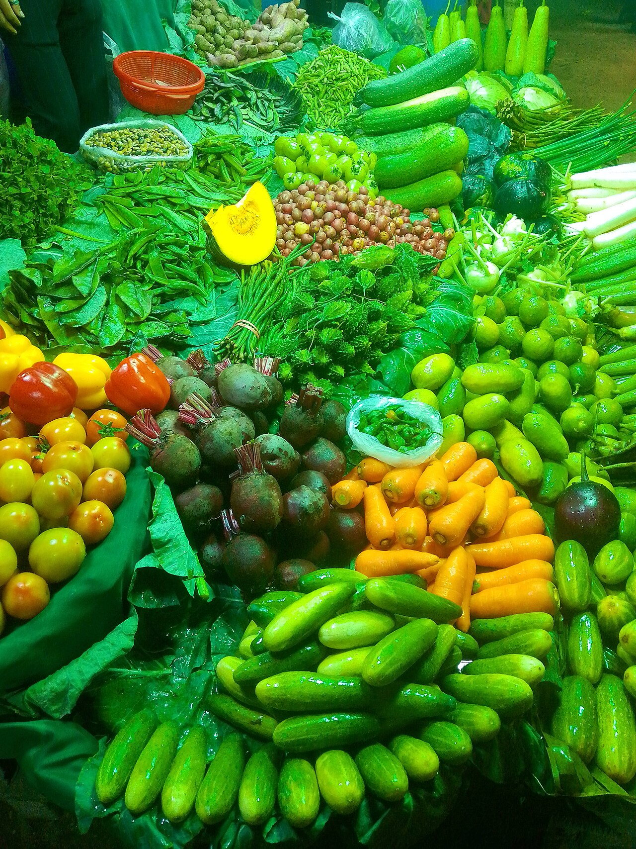 A vegetable shop in Dhaka. Ginger, onion, garlic and most vegetables have become more expensive in the capital's kitchen markets, while egg prices have eased slightly.